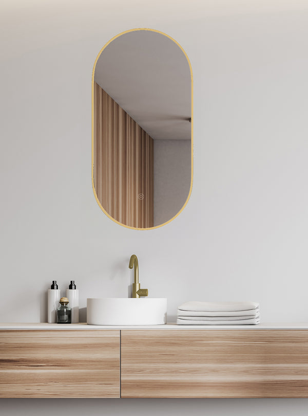 Nomi mirror 50 x 100 cm oval framed with LED, dimmable and demister gold