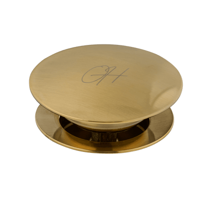 Detail van afvoerplug Flusso in goud met overloop